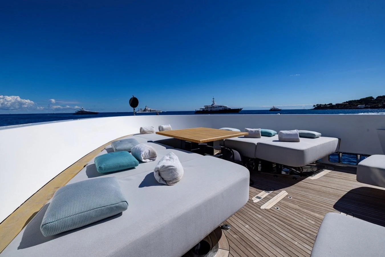 The sundeck offers luxurious lounging with plush seating and stunning ocean views. aboard LADY LU' Yacht for Sale
