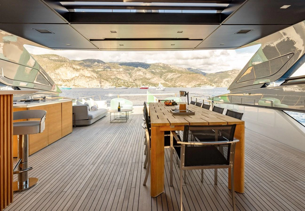 The aft deck features a spacious dining area with stunning views of the surrounding waters. aboard LADY LU' Yacht for Sale