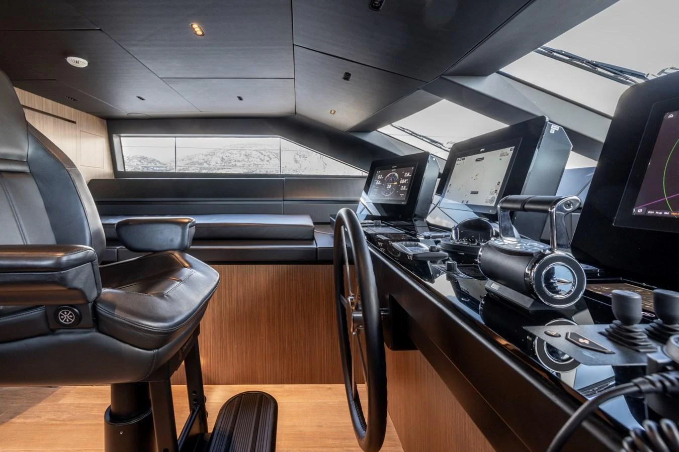 The helm station features advanced navigation equipment and luxurious seating, offering a commanding view for the captain. aboard LADY LU' Yacht for Sale