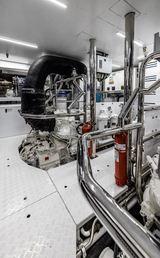 The image showcases a well-maintained engine room with polished metal surfaces and essential equipment. aboard LADY LU' Yacht for Sale