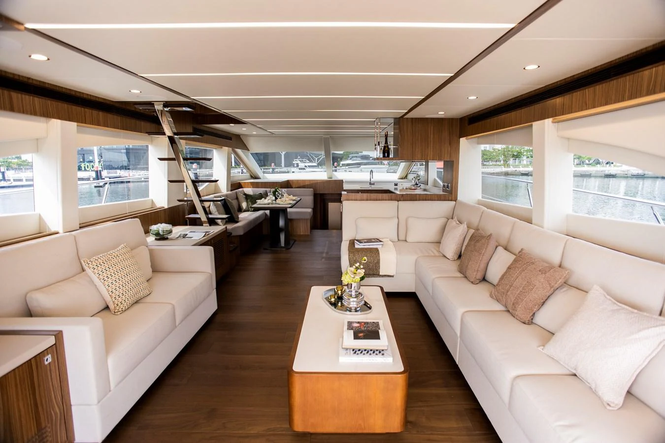 a living room with a large window aboard 70' JOHNSON SKYLOUNGE 2026 Yacht for Sale