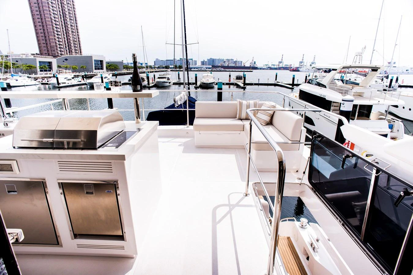 a boat dock with many boats aboard 70' JOHNSON SKYLOUNGE 2026 Yacht for Sale