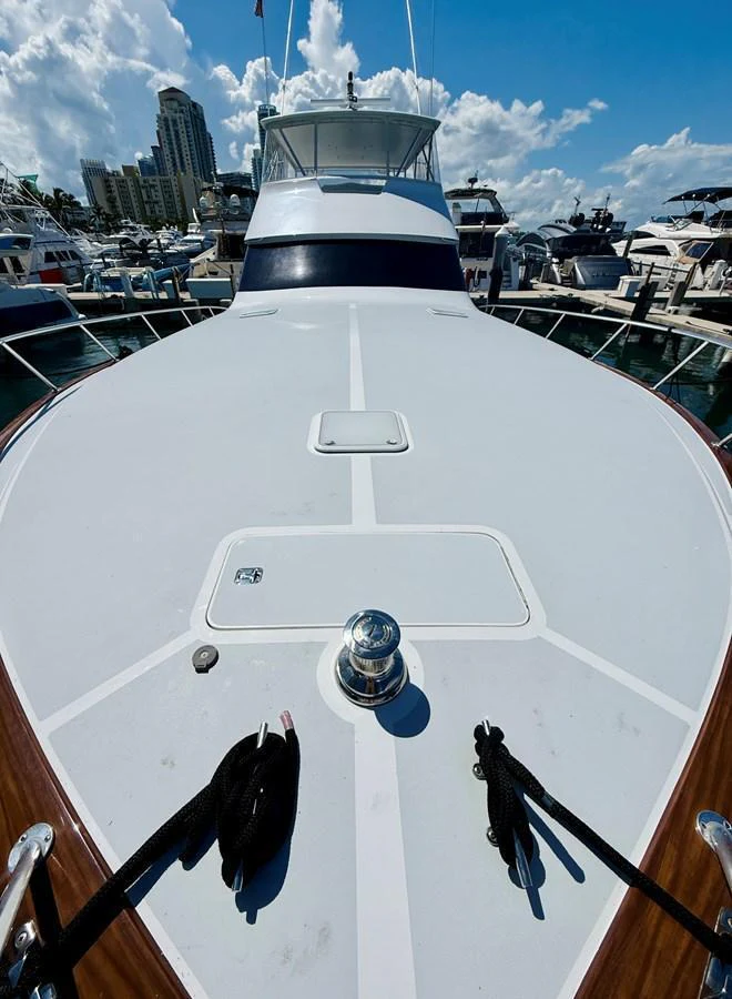 The foredeck of the yacht offers a spacious and clean layout, perfect for sunbathing or enjoying the view. aboard KICKBACK Yacht for Sale