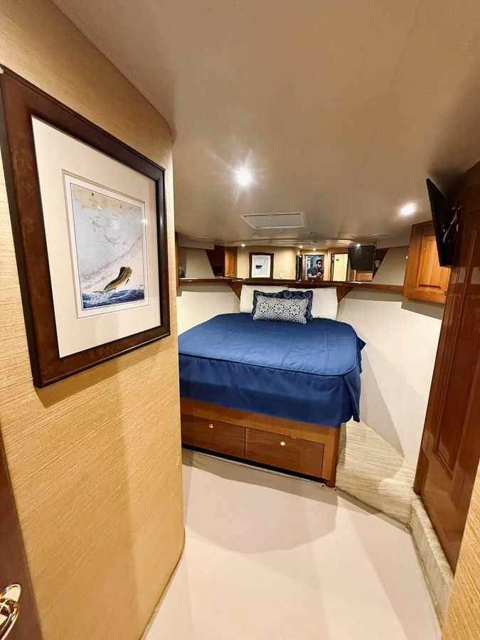 A cozy stateroom with a comfortable bed and elegant decor. aboard KICKBACK Yacht for Sale