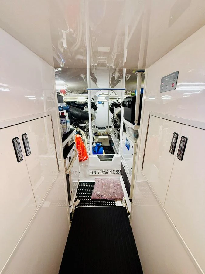 The image showcases the clean and well-organized engine room of the yacht. aboard KICKBACK Yacht for Sale