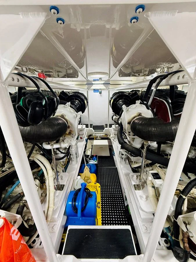 The image showcases a well-organized and clean engine room with high-quality machinery. aboard KICKBACK Yacht for Sale