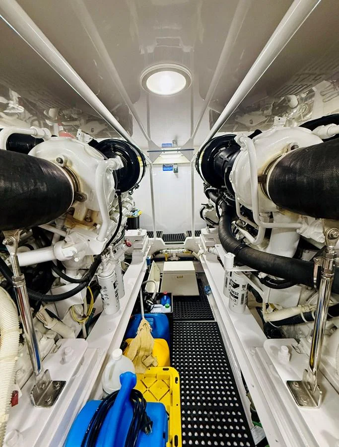 The image showcases the well-maintained engine room of the yacht, highlighting its mechanical components. aboard KICKBACK Yacht for Sale