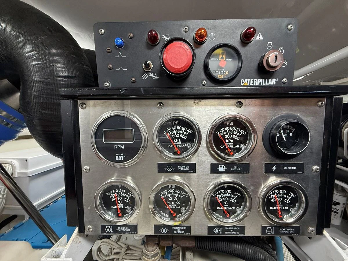 A close-up view of the yacht's engine control panel showcasing various gauges and indicators. aboard KICKBACK Yacht for Sale