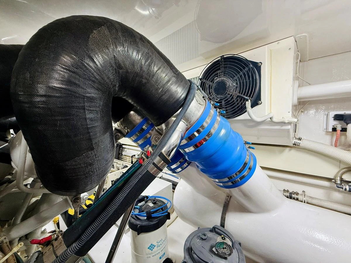 The image showcases a detailed view of the yacht's engine room, highlighting the mechanical components and systems. aboard KICKBACK Yacht for Sale
