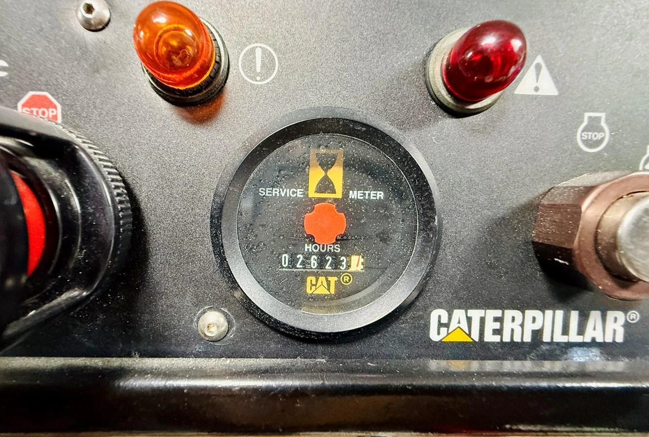 A close-up view of a Caterpillar service meter showing operational hours. aboard KICKBACK Yacht for Sale