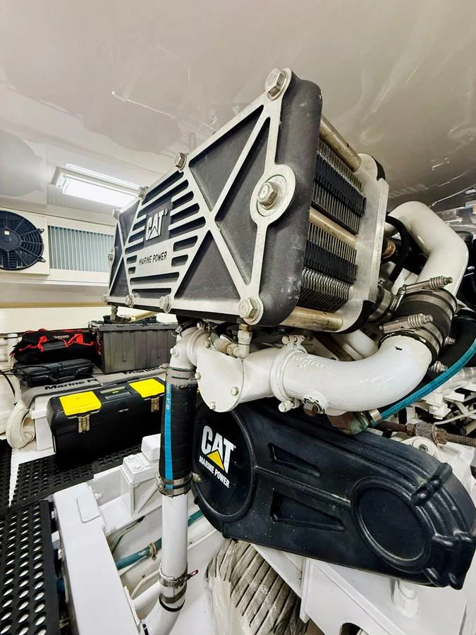 The image showcases the powerful engine room of the yacht, featuring high-performance machinery. aboard KICKBACK Yacht for Sale