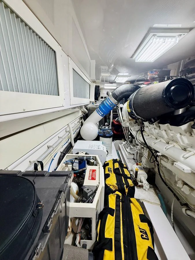 The image showcases the yacht's engine room, highlighting its mechanical components and storage areas. aboard KICKBACK Yacht for Sale
