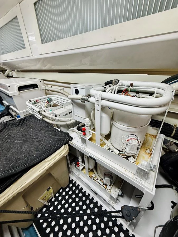 The image showcases the yacht's technical equipment and machinery in a well-organized space. aboard KICKBACK Yacht for Sale