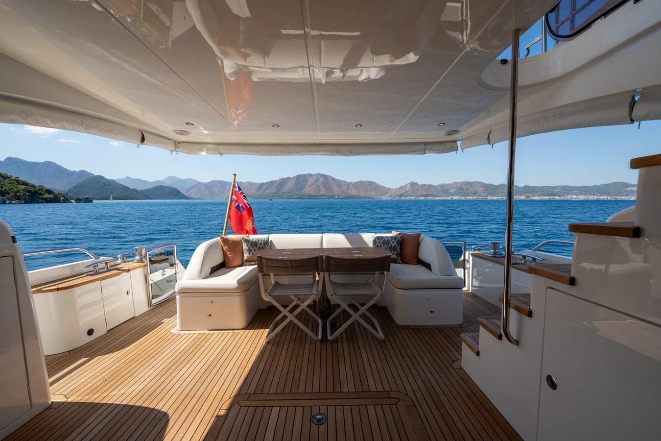 a boat with a deck and chairs aboard MY LADY Yacht for Sale