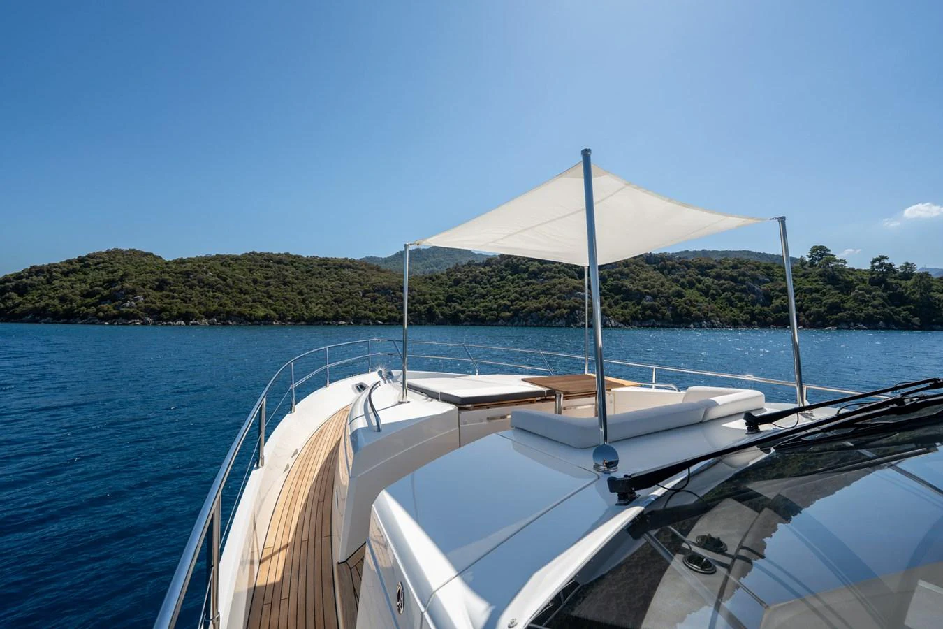 a boat with an umbrella on it aboard MY LADY Yacht for Sale
