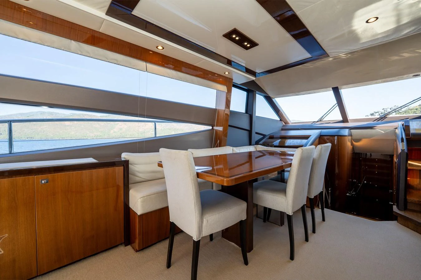 a room with a table and chairs aboard MY LADY Yacht for Sale