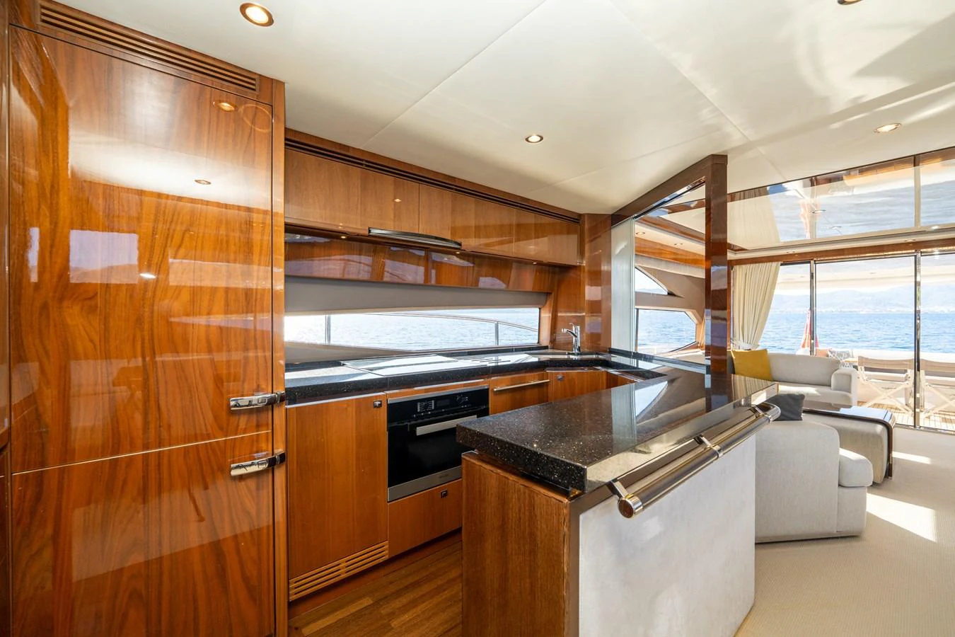 a kitchen with wooden cabinets aboard MY LADY Yacht for Sale