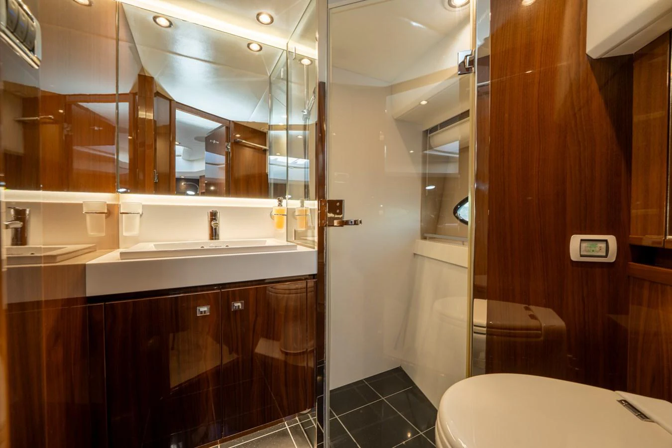 a bathroom with a large mirror aboard MY LADY Yacht for Sale