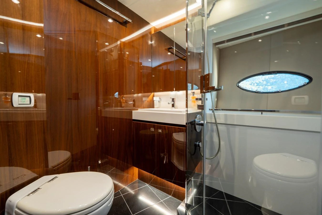 a bathroom with a glass shower aboard MY LADY Yacht for Sale