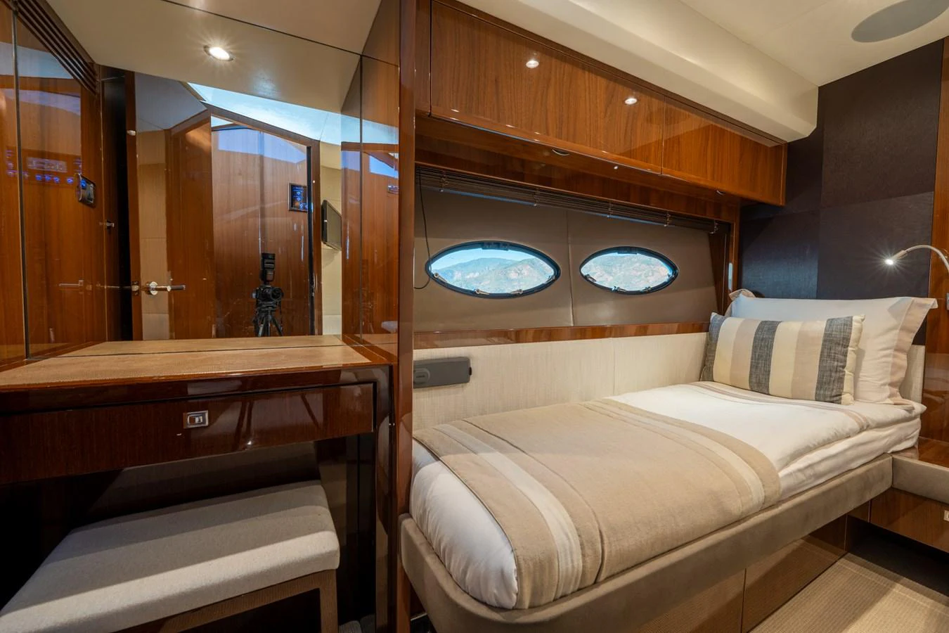 a room with a bed and a mirror aboard MY LADY Yacht for Sale