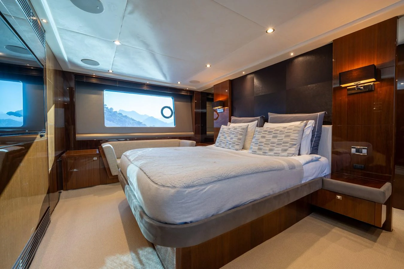 a room with a bed and a television aboard MY LADY Yacht for Sale