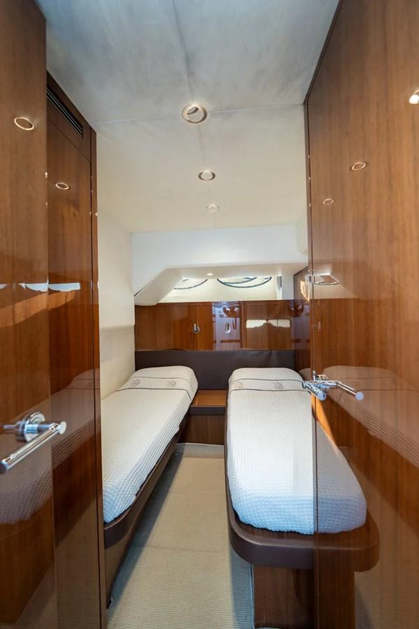 a bathroom with a tub and a bed aboard MY LADY Yacht for Sale