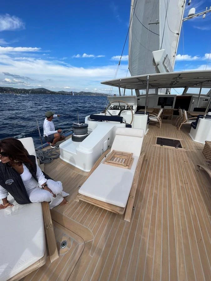 The yacht's deck offers a spacious and inviting area for relaxation and enjoyment under the open sky. aboard MUMU Yacht for Sale