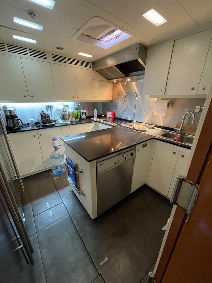 The yacht's galley is well-equipped with modern appliances and ample counter space. aboard MUMU Yacht for Sale