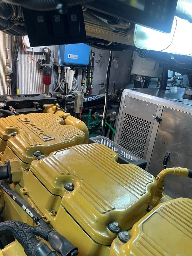 The image showcases the yacht's engine room with visible machinery and equipment. aboard MUMU Yacht for Sale
