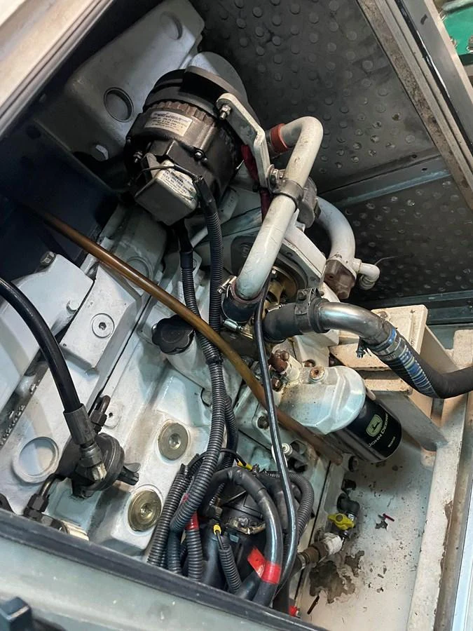 A close-up view of the yacht's engine room showcasing the mechanical components. aboard MUMU Yacht for Sale