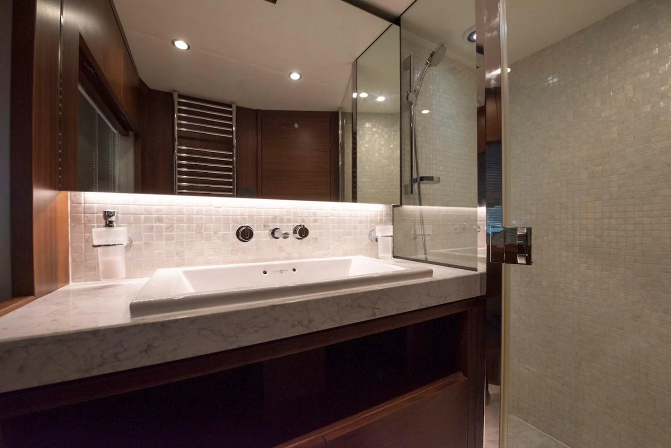 a bathroom with a large mirror aboard LADY PARISA Yacht for Sale