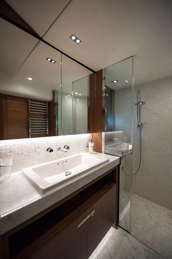 a bathroom with a large mirror aboard LADY PARISA Yacht for Sale