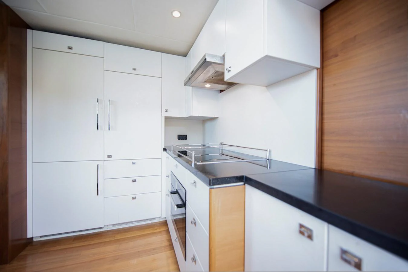 a kitchen with white cabinets aboard LADY PARISA Yacht for Sale
