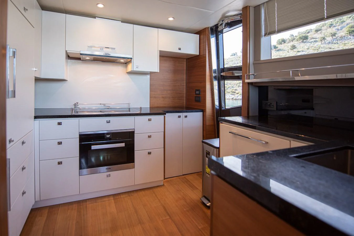 a kitchen with white cabinets aboard LADY PARISA Yacht for Sale