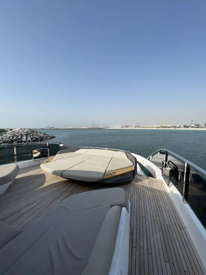 The yacht's foredeck features luxurious sun pads with a stunning view of the water. aboard SEMIA Yacht for Sale