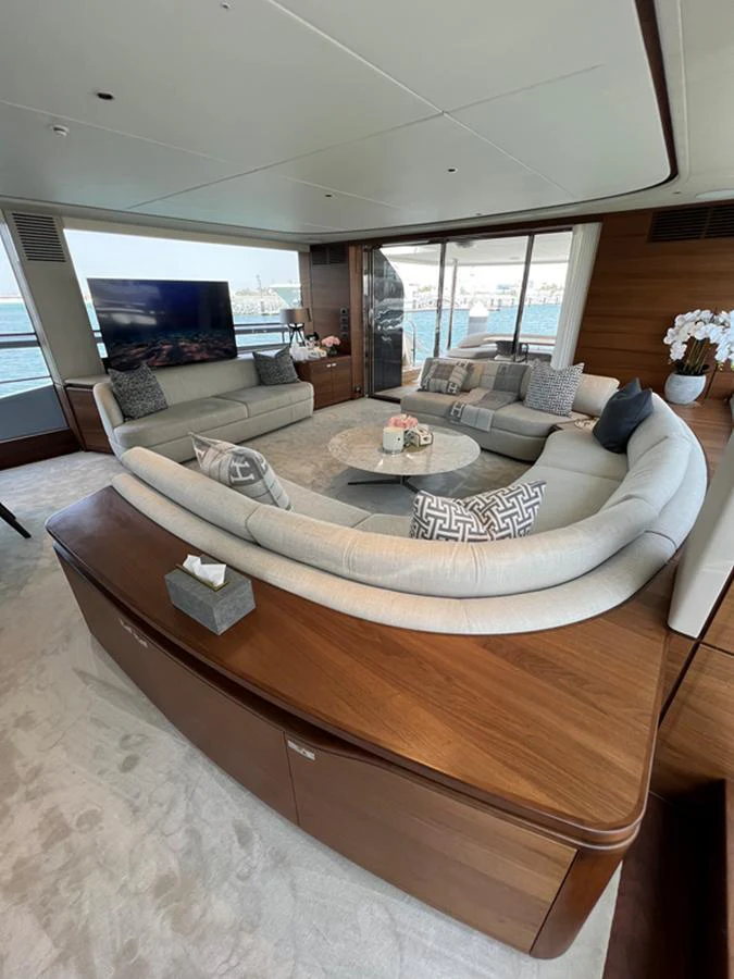 The salon features a spacious seating area with elegant furnishings and panoramic windows offering stunning views. aboard SEMIA Yacht for Sale