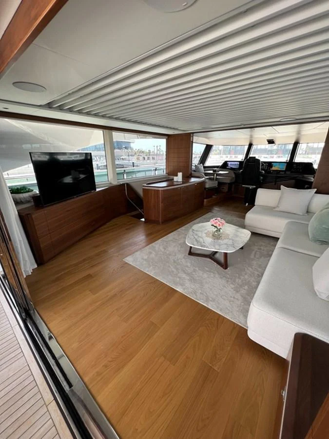 The yacht's salon features a comfortable seating area with a modern design and ample natural light. aboard SEMIA Yacht for Sale