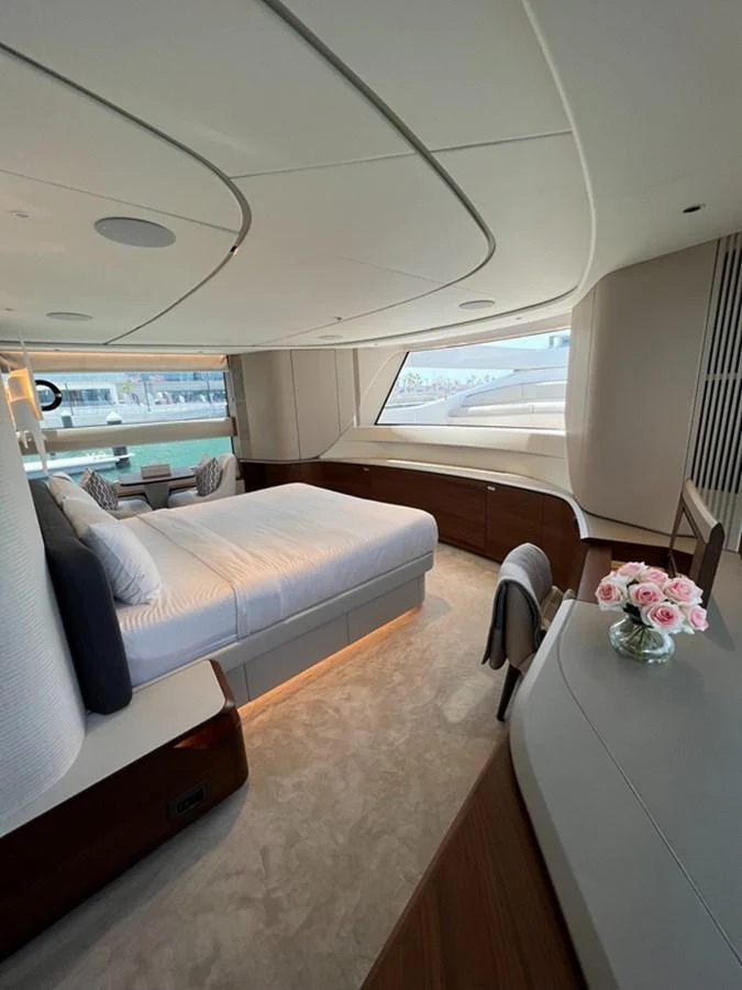 The master stateroom features a luxurious bed and elegant furnishings with ample natural light. aboard SEMIA Yacht for Sale