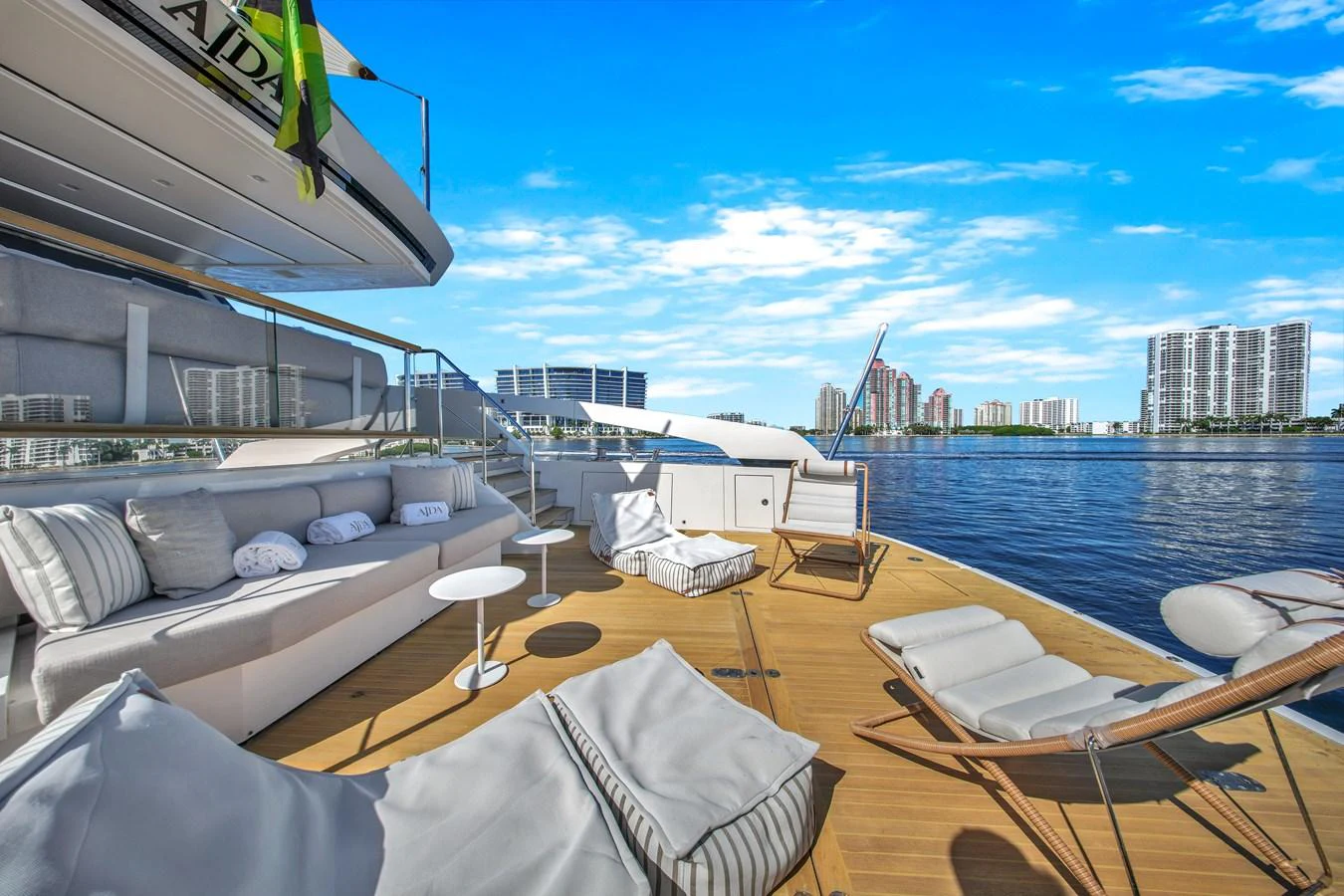 The yacht's aft deck offers a luxurious lounging area with stunning waterfront views. aboard AIDA Yacht for Sale