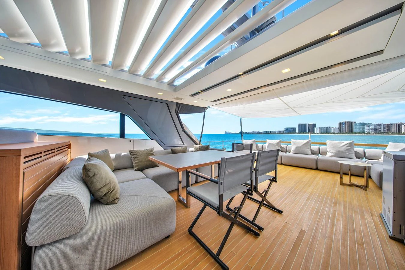 The spacious aft deck offers luxurious seating and stunning ocean views. aboard AIDA Yacht for Sale