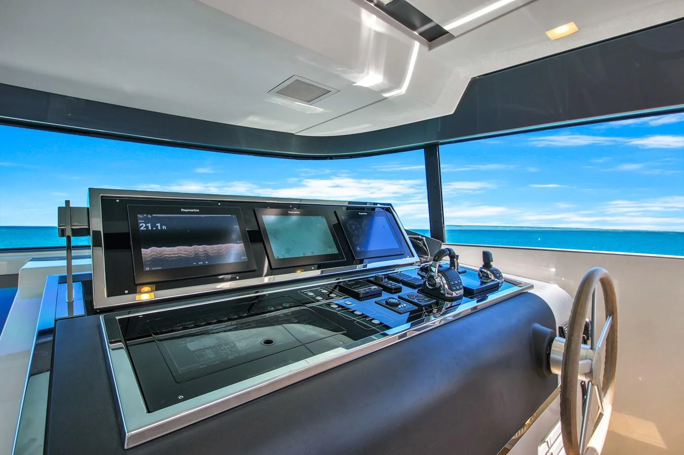 The helm station offers a sleek and modern command center with panoramic ocean views. aboard AIDA Yacht for Sale