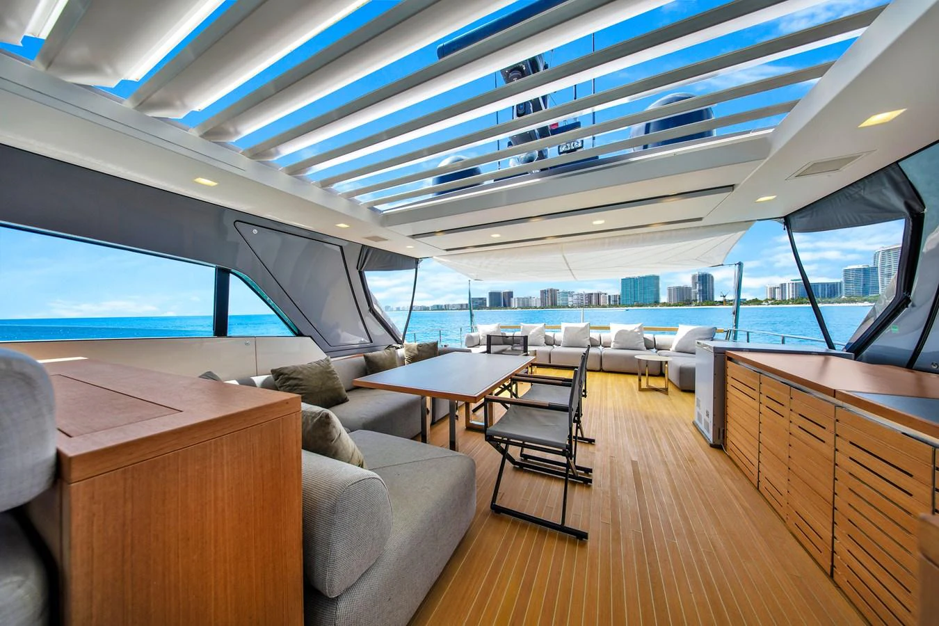 The aft deck offers a spacious and luxurious seating area with stunning views of the water. aboard AIDA Yacht for Sale