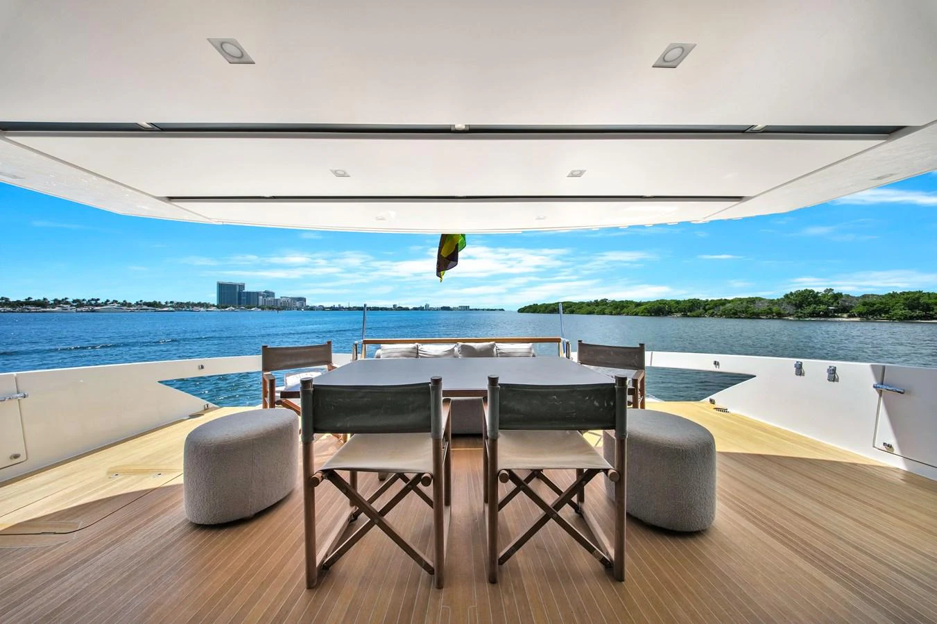 The aft deck offers a serene dining area with stunning water views. aboard AIDA Yacht for Sale