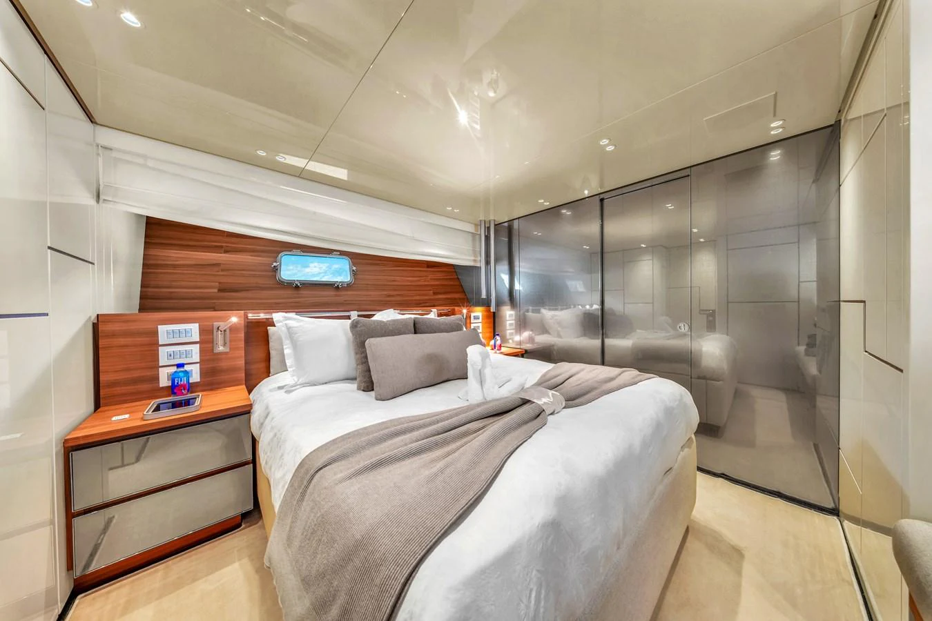 A luxurious stateroom featuring a large bed with plush bedding and modern decor. aboard AIDA Yacht for Sale