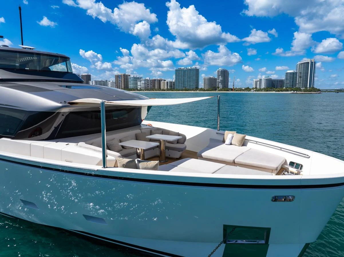 The yacht's foredeck offers a luxurious lounging area with comfortable seating and a sunshade, perfect for relaxation. aboard AIDA Yacht for Sale