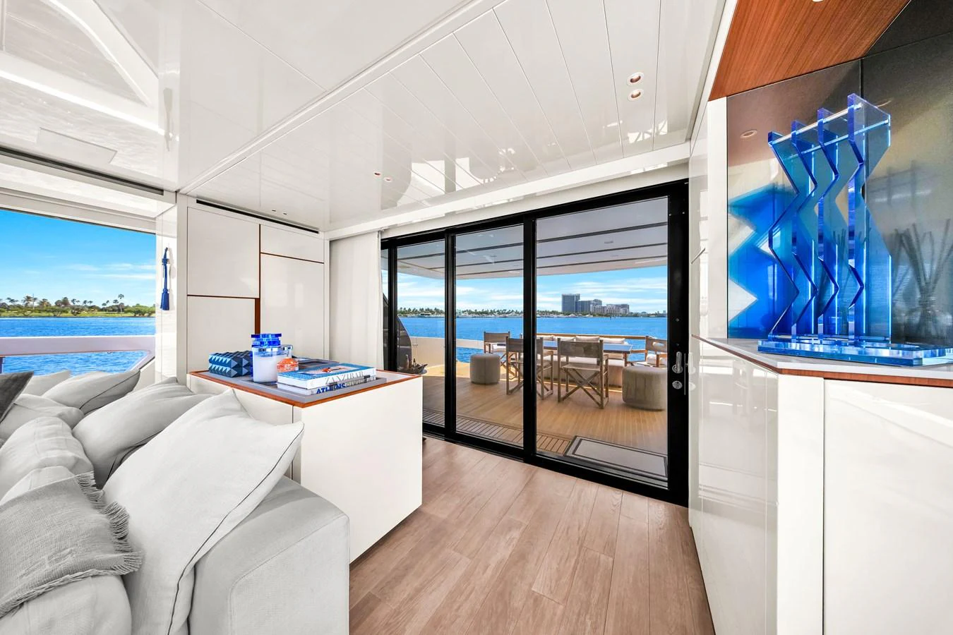 The salon offers a luxurious and spacious area with a seamless transition to the aft deck, featuring modern decor and expansive views. aboard AIDA Yacht for Sale