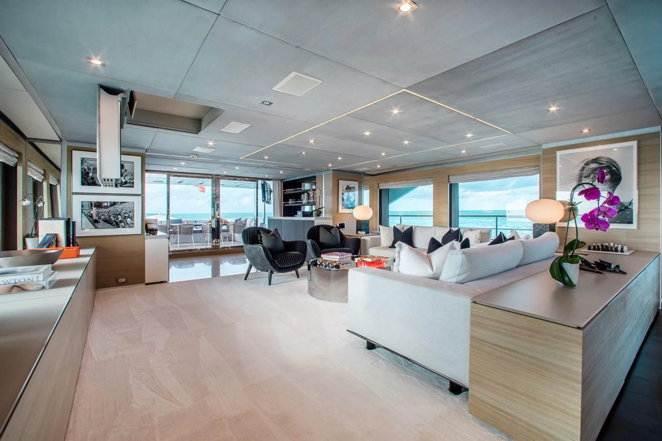 The salon offers a spacious and elegantly designed area with ample seating and panoramic views. aboard EMINA Yacht for Sale