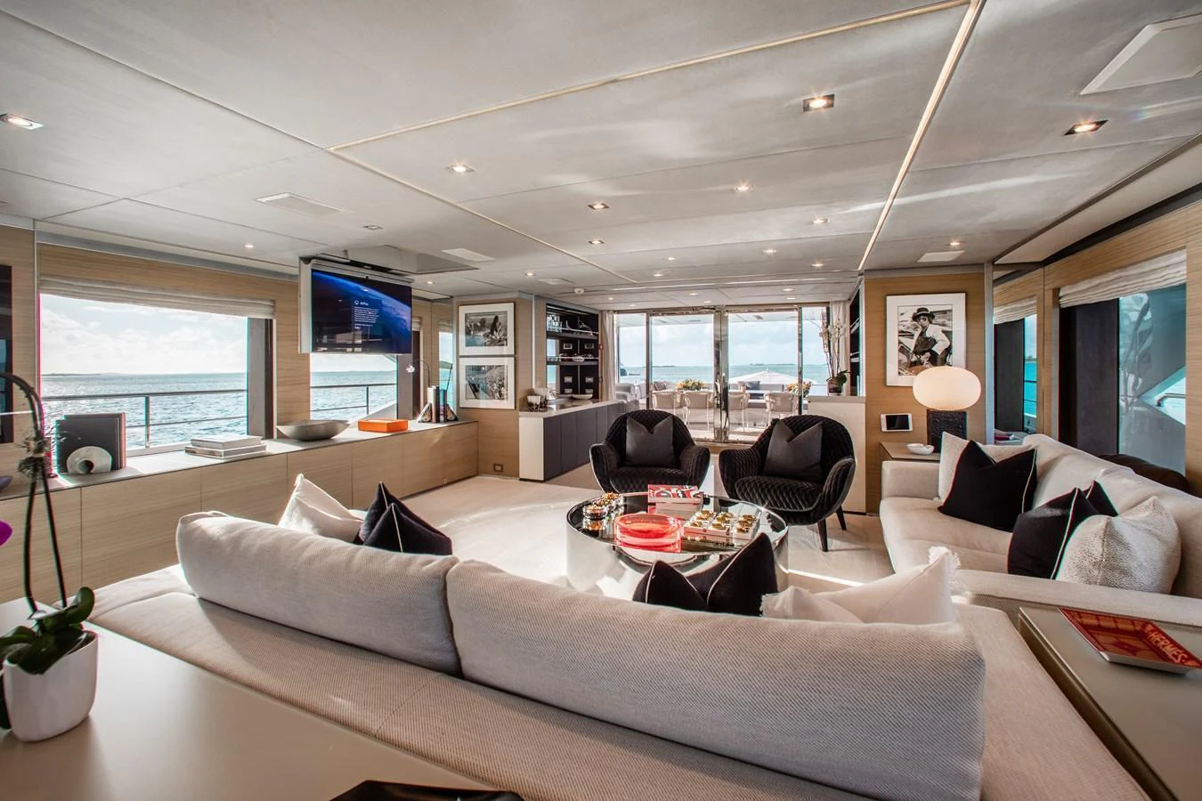 The salon offers a spacious and luxurious living area with ample seating and panoramic views. aboard EMINA Yacht for Sale