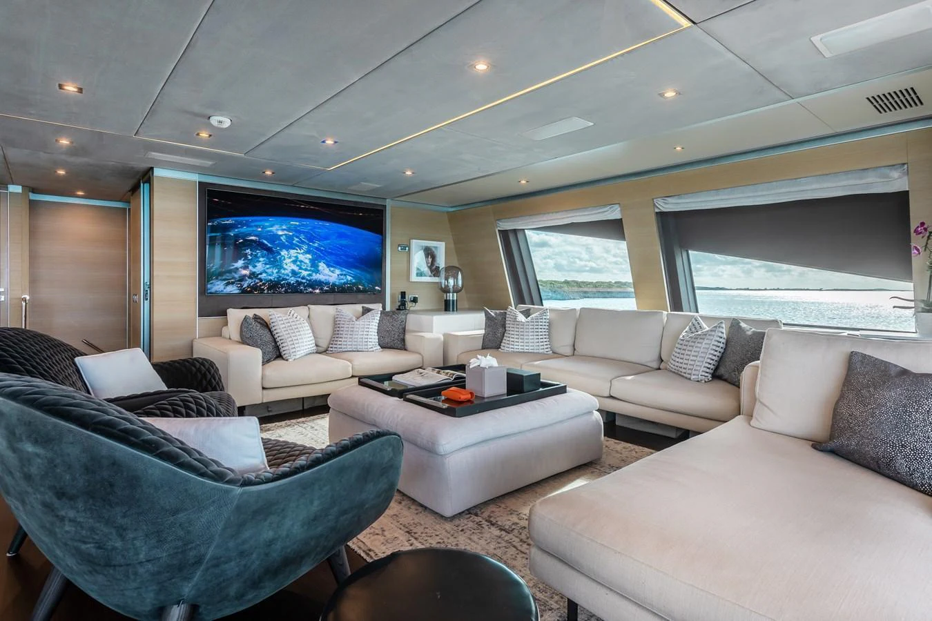 The salon offers a spacious and luxurious seating area with panoramic views and modern decor. aboard EMINA Yacht for Sale