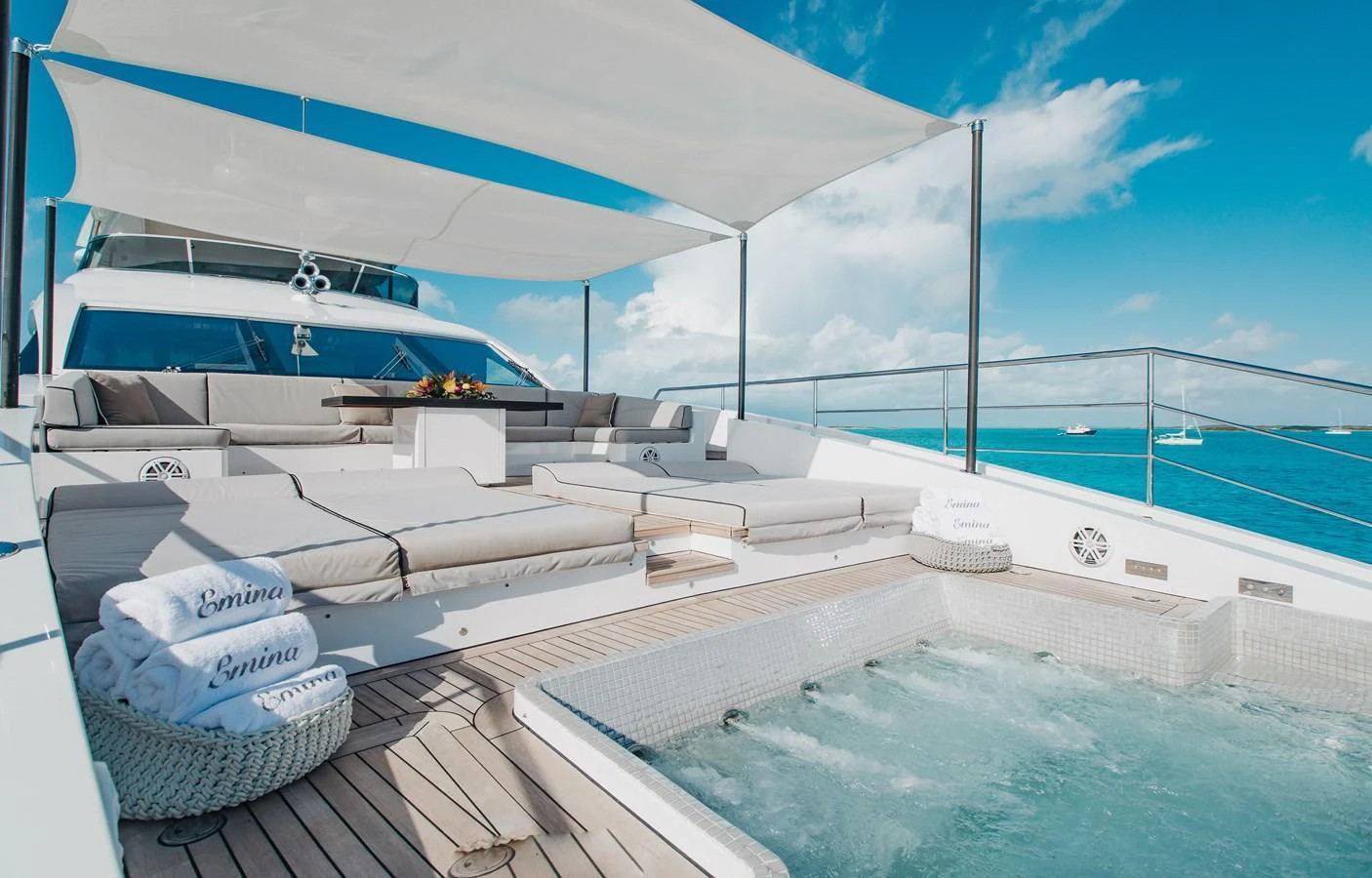 The sundeck features a luxurious jacuzzi and ample lounging space under shade canopies. aboard EMINA Yacht for Sale